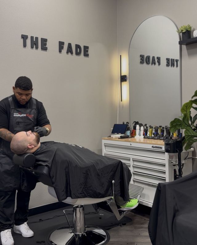 Germain Style, barber at The Fade Barber Studio, giving a client a precision fade